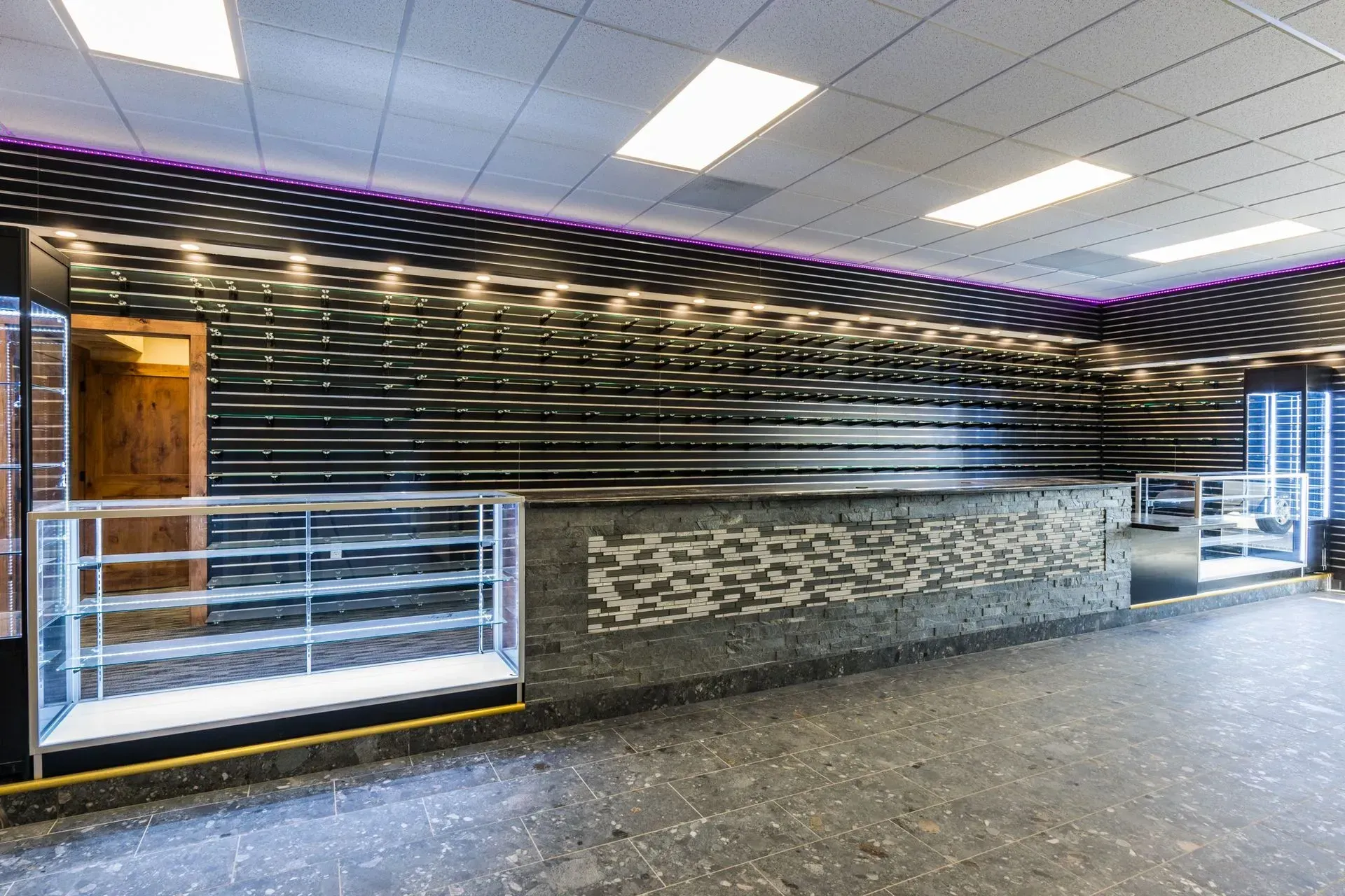 A large room with a counter and display cases