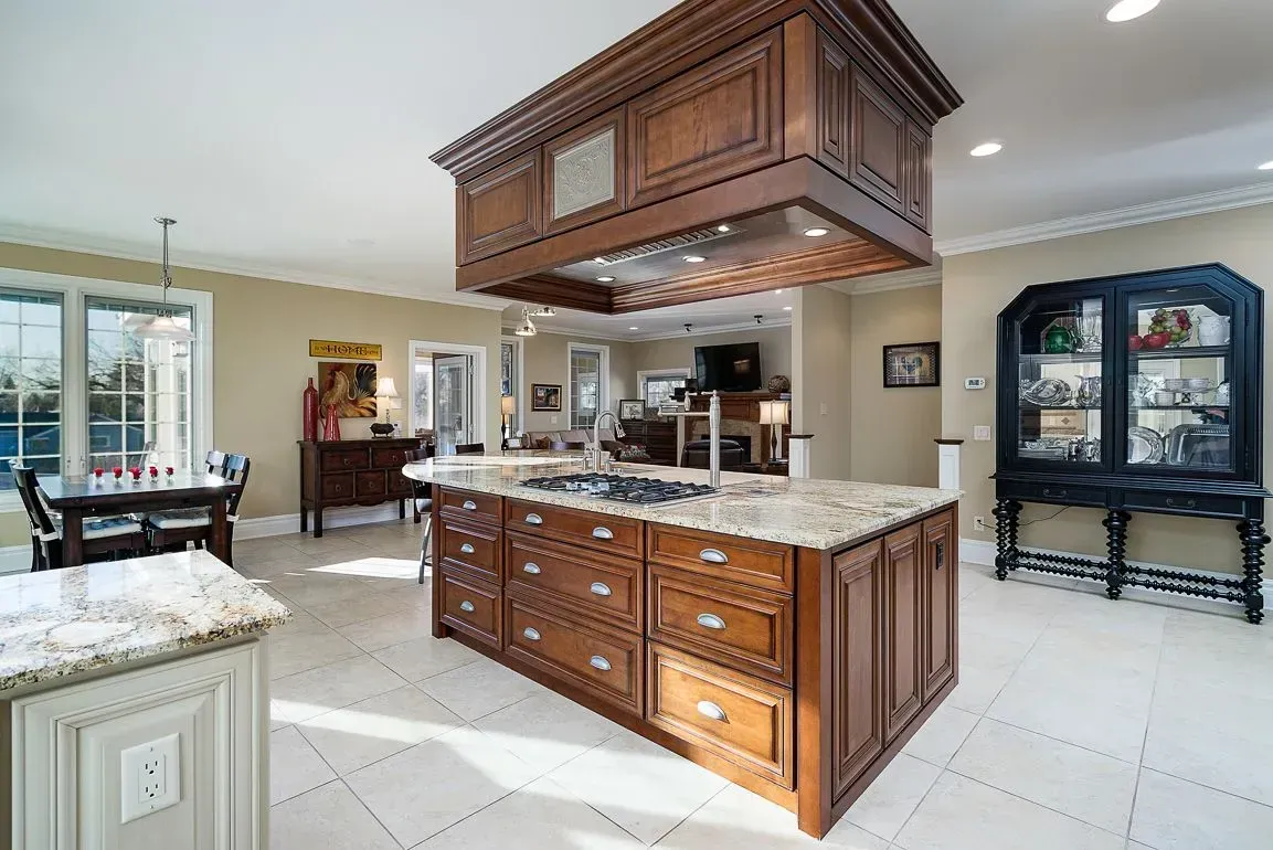 There is a large island in the middle of the kitchen.