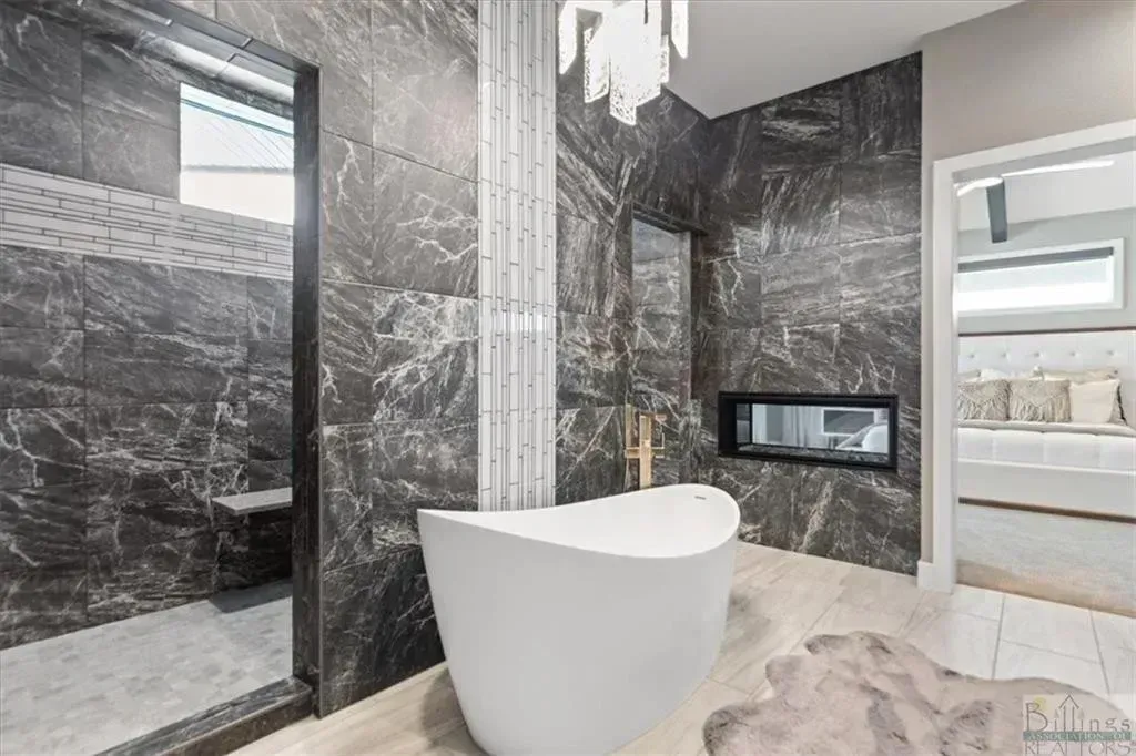 There is a bathtub in the middle of the bathroom.