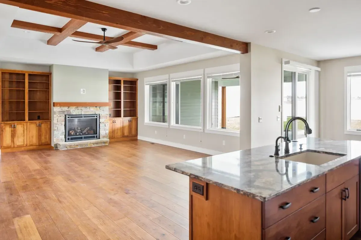 There is a fireplace in the middle of the living room.