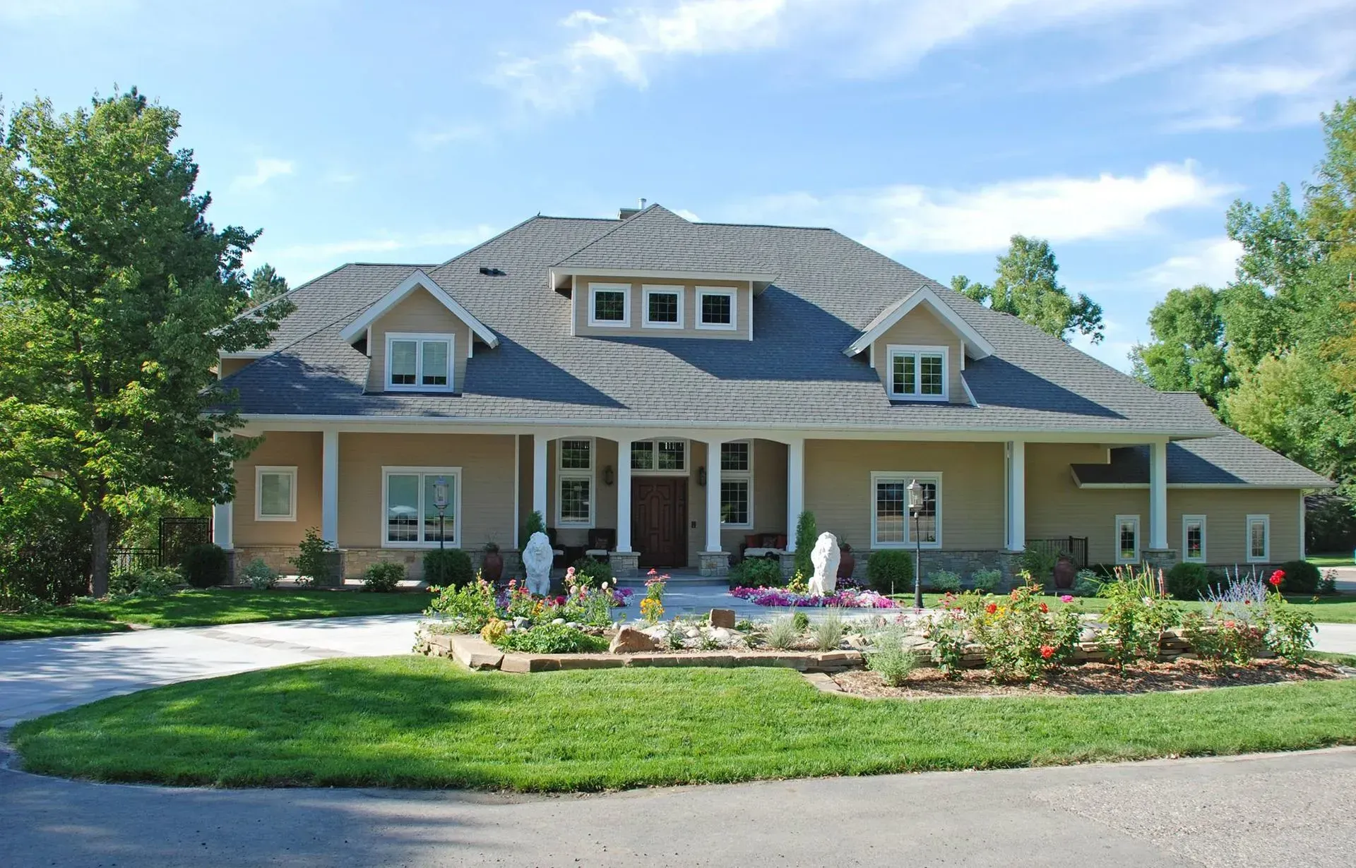 A large house with a lot of windows and a gray roof
