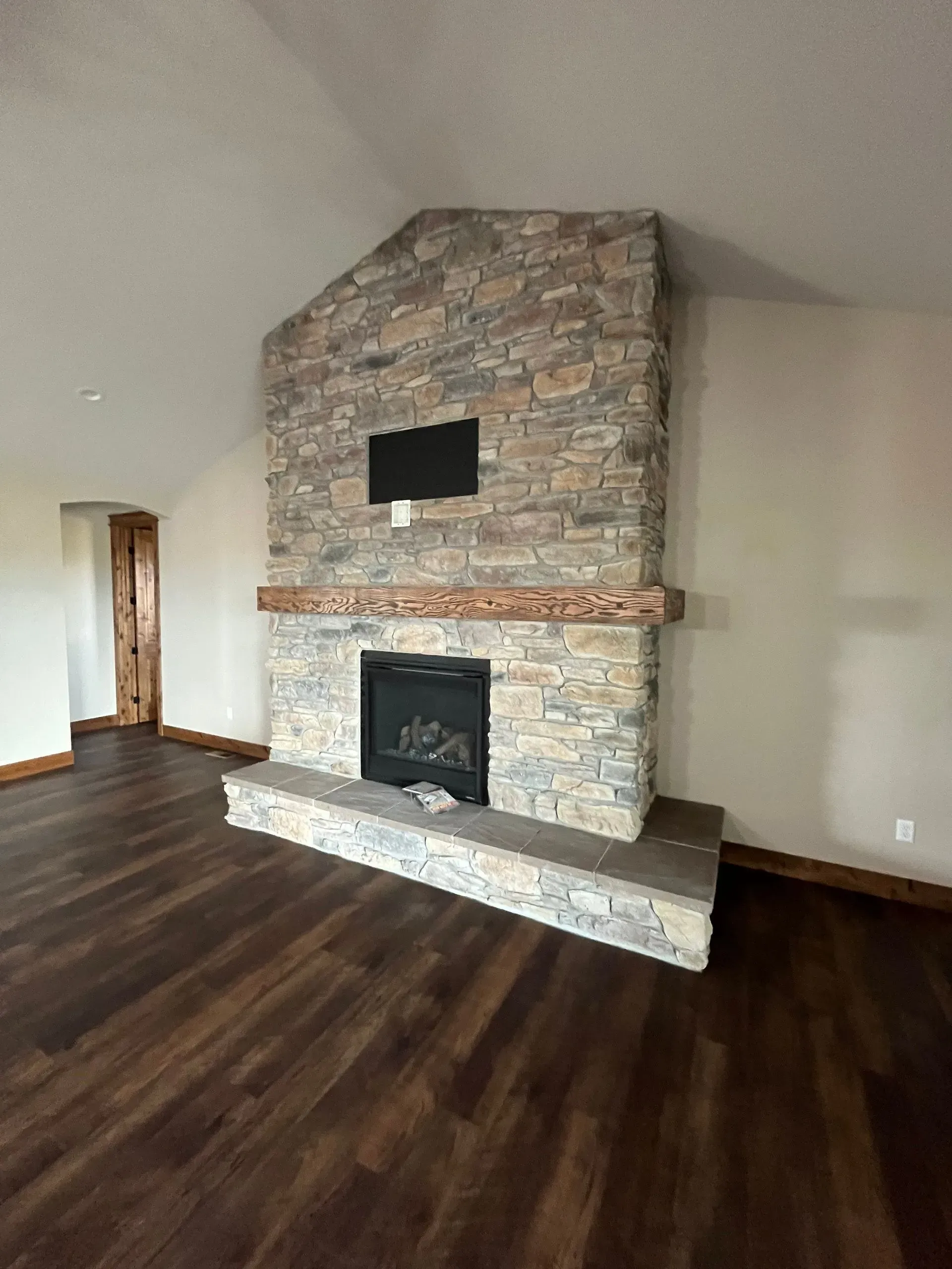 There is a fireplace in the middle of the room.