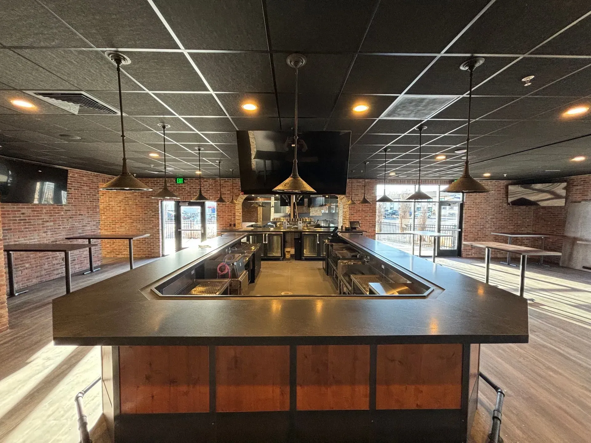 There is a long bar in the middle of the room.