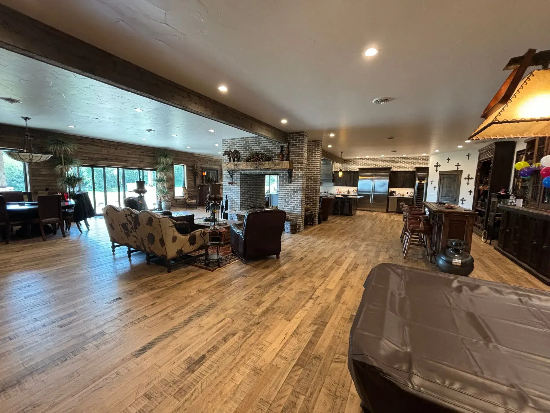 A large living room filled with furniture and a fireplace.