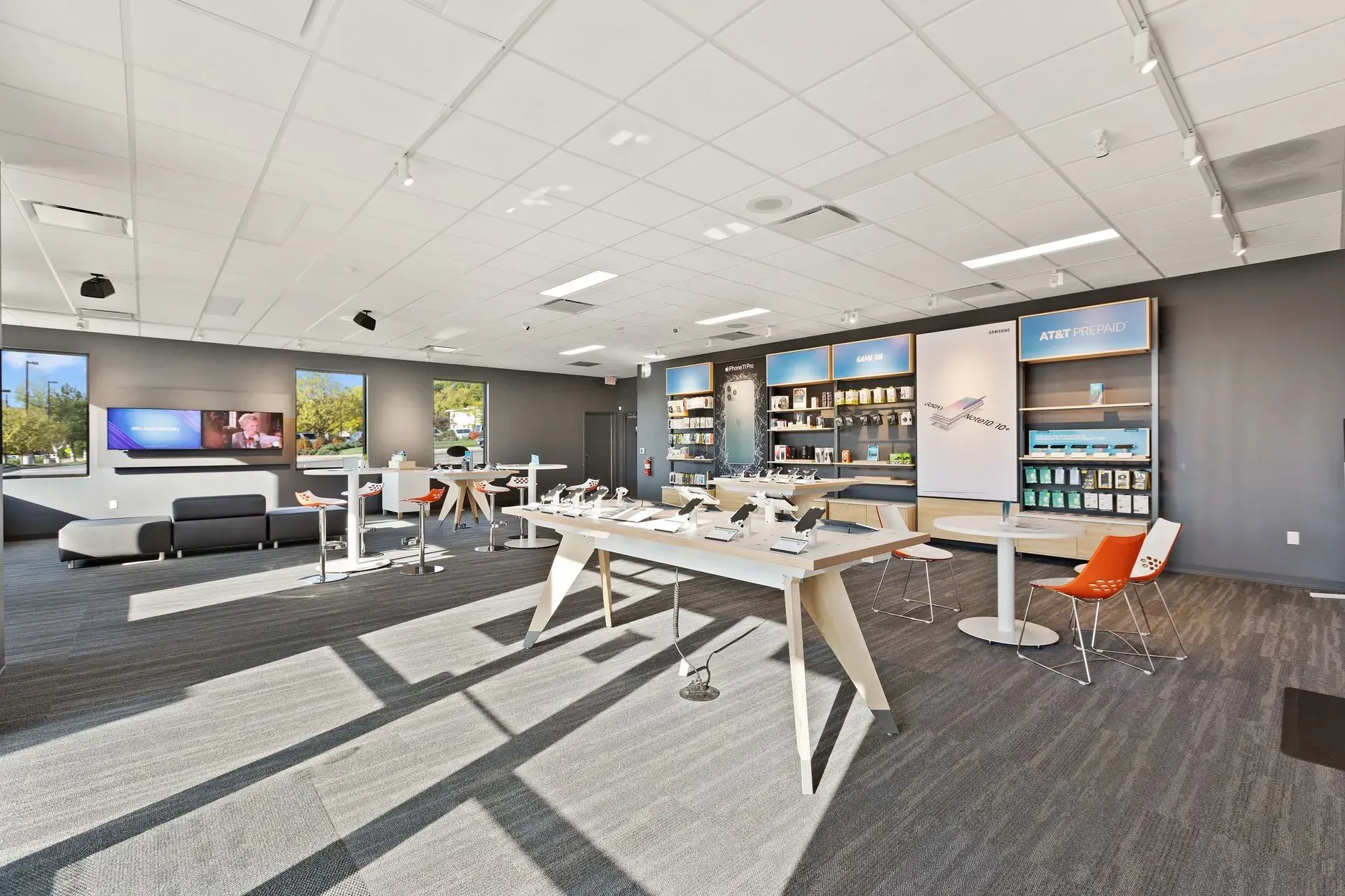 A large room with a table and chairs in it