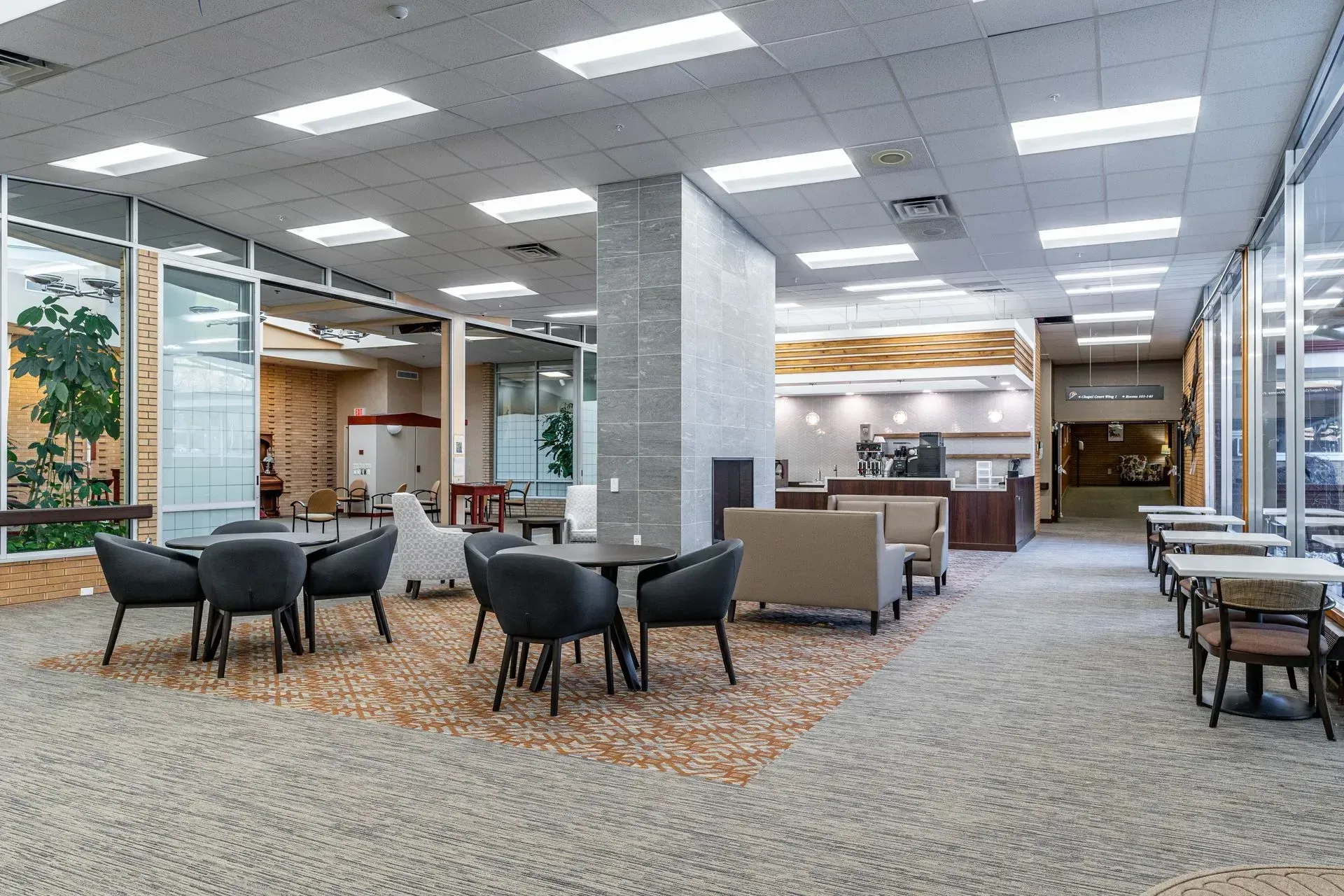 A large room with tables and chairs in it