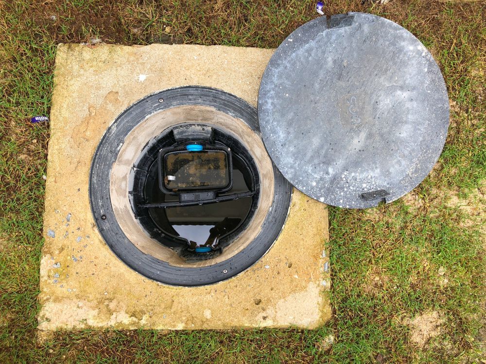 Open Grease Trap Hole in Concrete Square — Paap's Cleansing Services in Woodgate, QLD