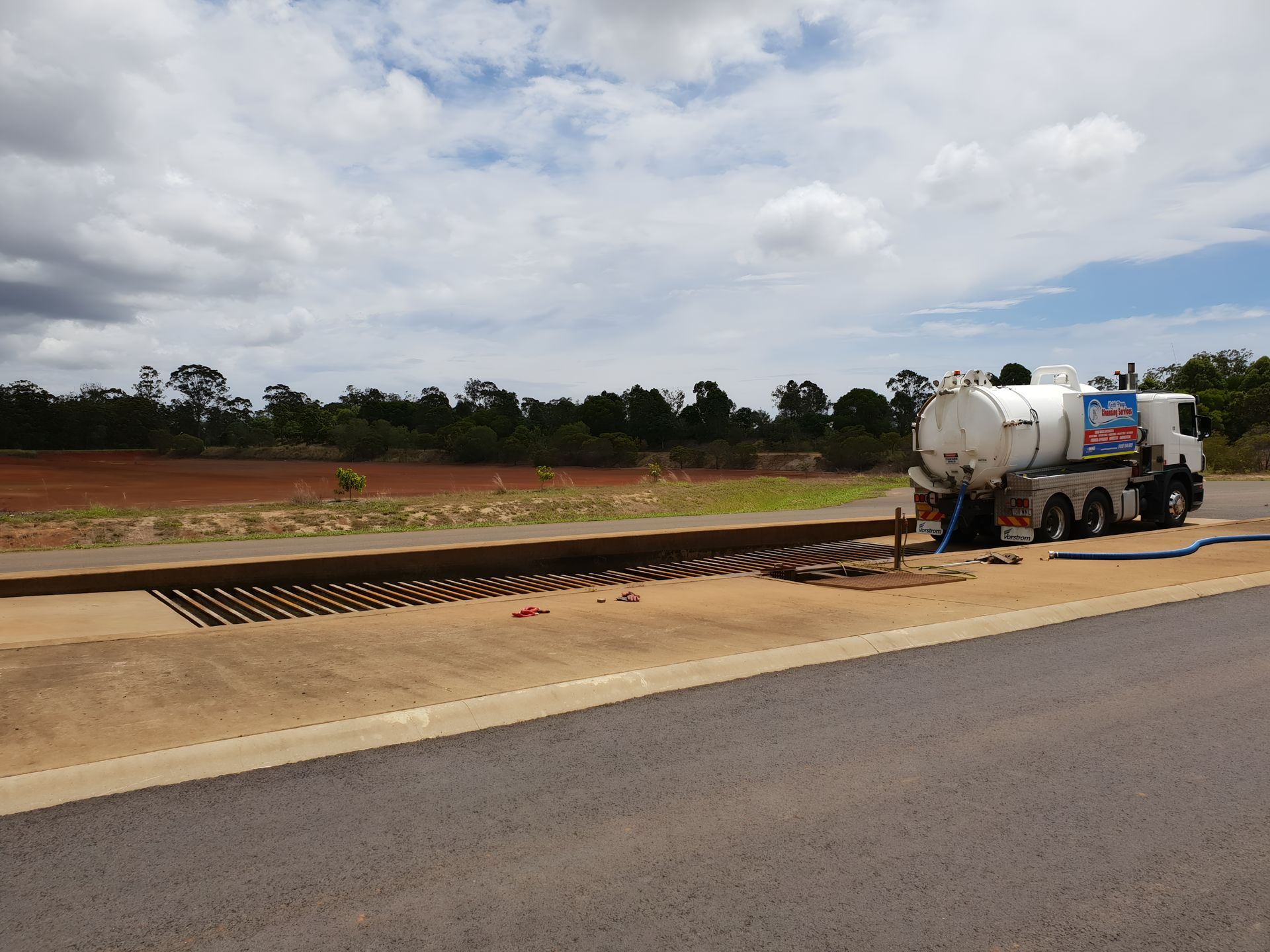 Tanker Truck Pumping at a Rectangular Concrete Structure — Paap's Cleansing Services in Lowmead, QLD