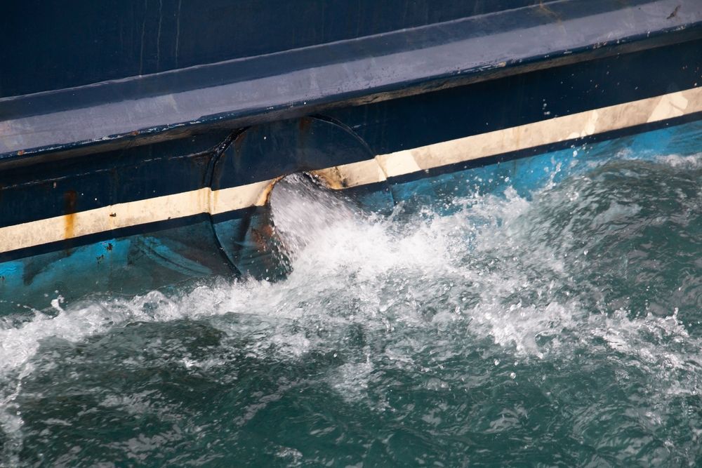 Boat Propeller Churning Water, Blue Hull, White Stripe — Paap's Cleansing Services in Branyan, QLD
