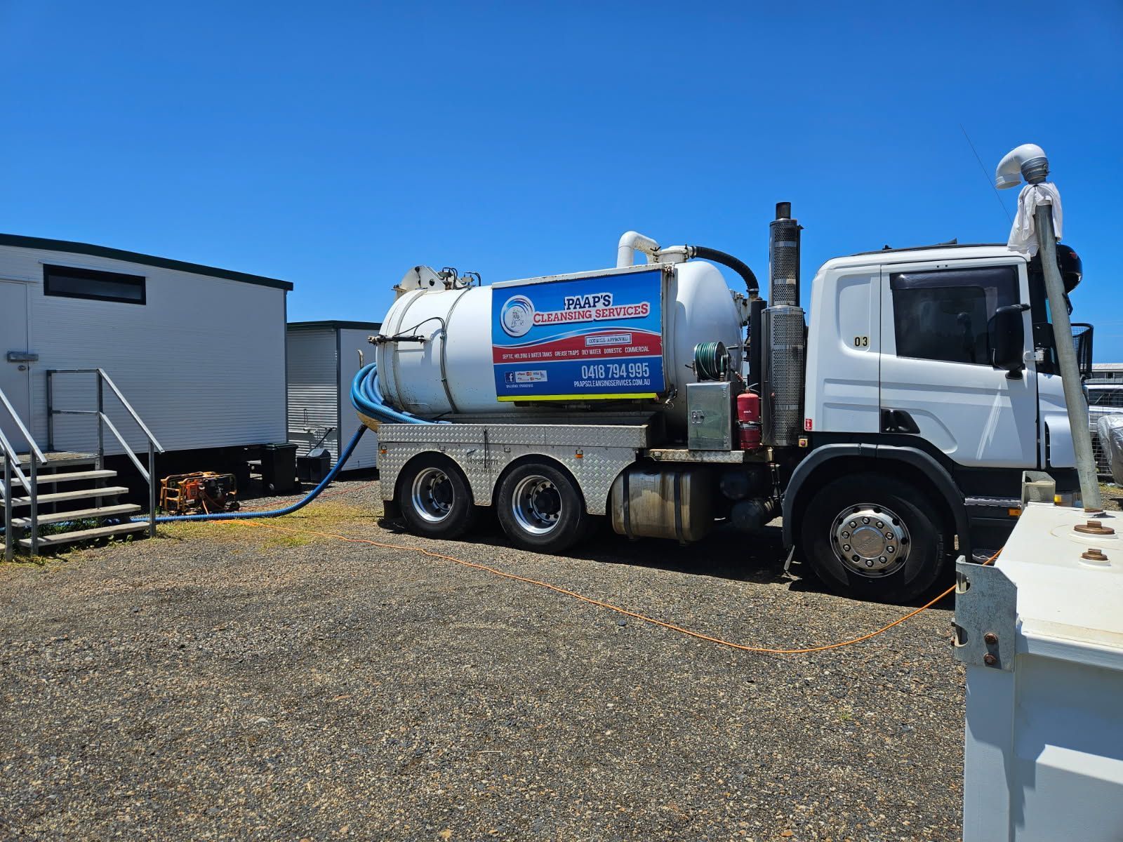 White Septic Truck Parked Near a Portable Building — Paap's Cleansing Services in Mount Perry, QLD