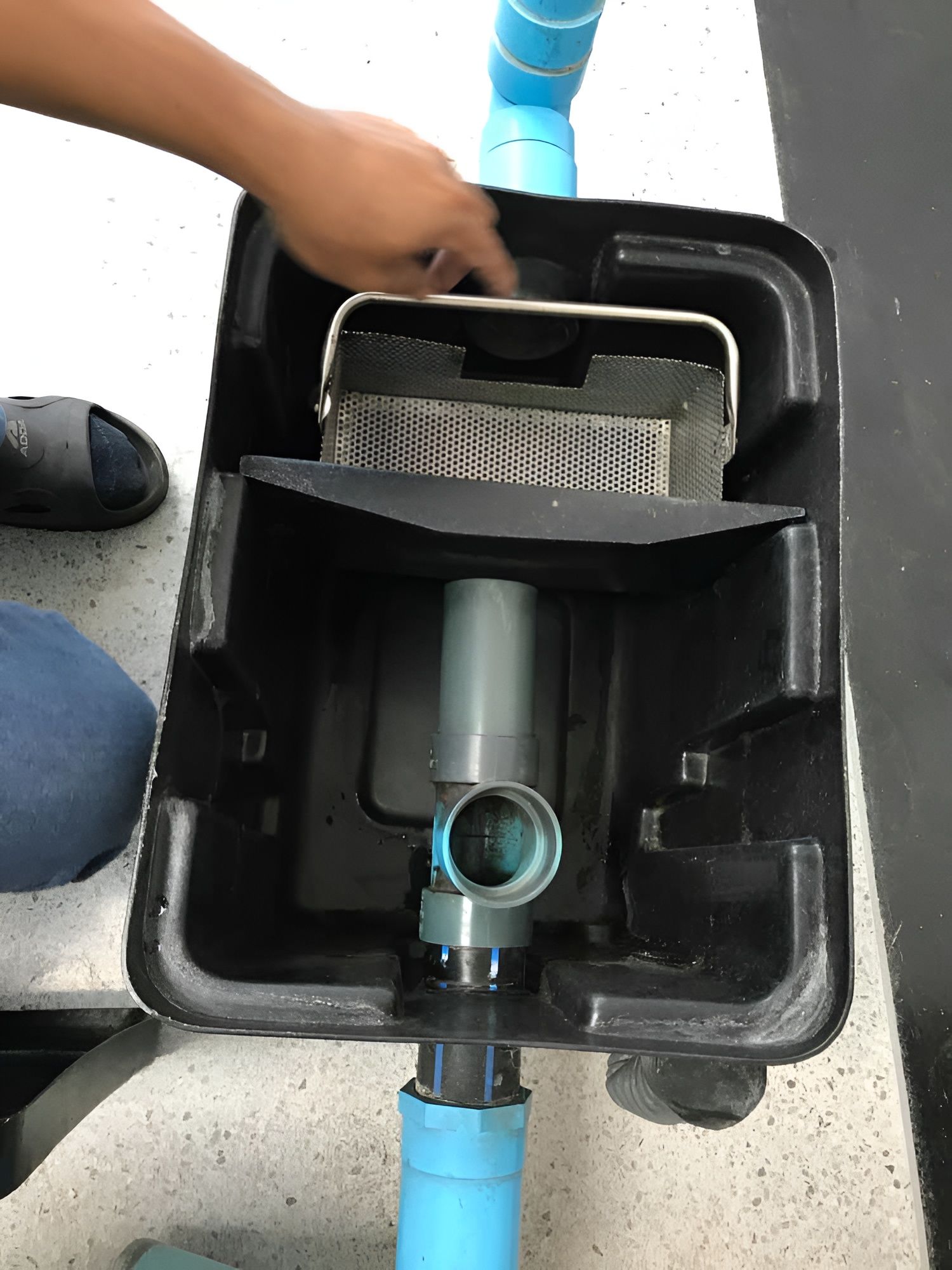 Top-down View of a Black Filter Box With Plumbing — Paap's Cleansing Services in Lowmead, QLD