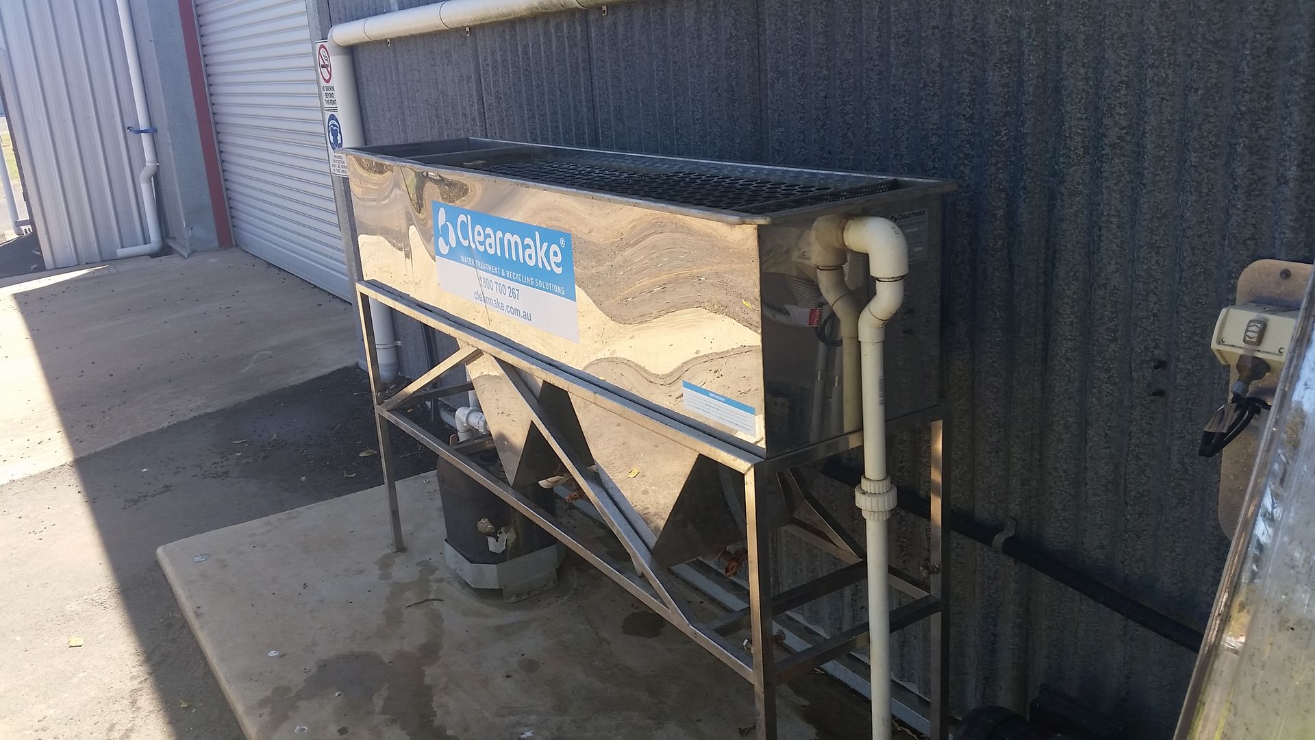 Stainless Steel Ice Machine Outside a Building — Paap's Cleansing Services in Branyan, QLD