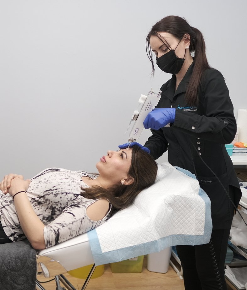 specialist getting mesotherapy on forehead