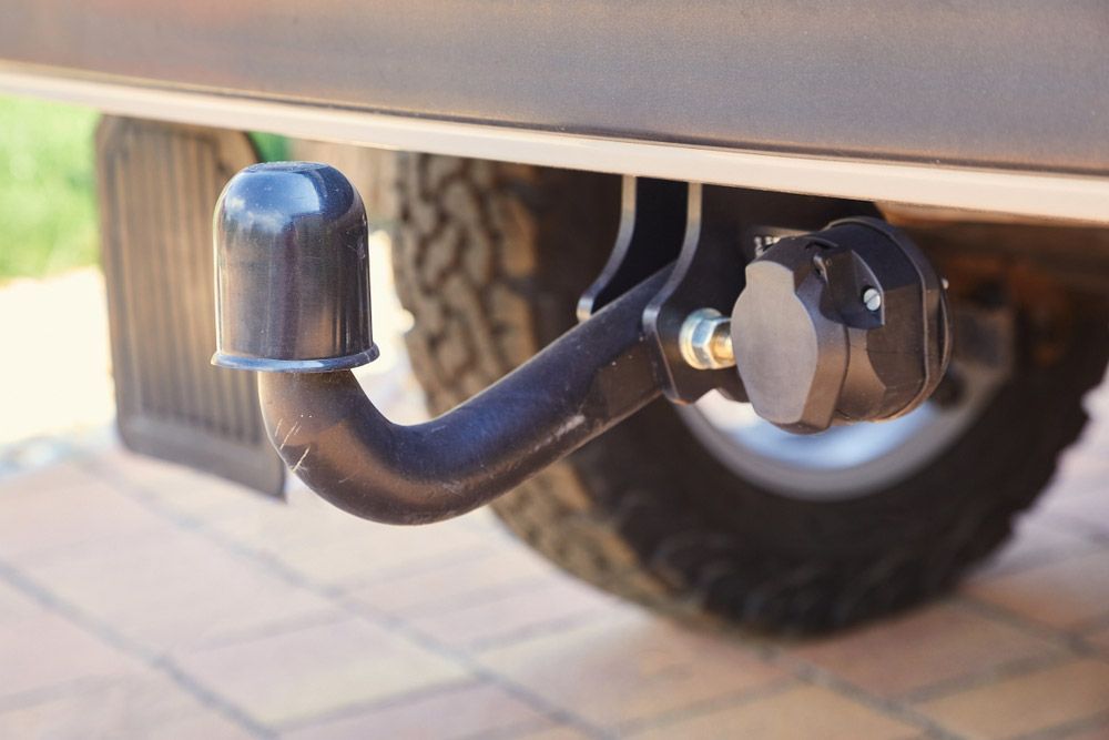 A Trailer Hitch Attached to A Vehicle's Undercarriage with A Covered Ball — Hervey Bay Brake and Exhaust in Pialba, QLD