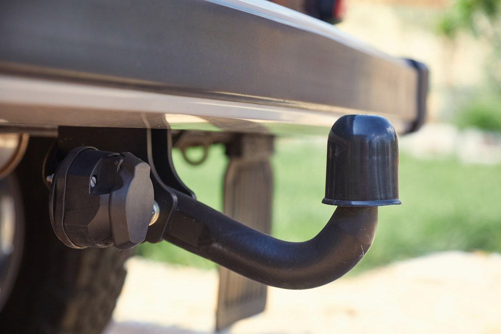 A Black Trailer Hitch on A Vehicle's Bumper — Hervey Bay Brake and Exhaust in Pialba, QLD