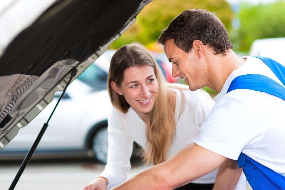 A Woman and Mechanic Looking at Car Engine — Hervey Bay Brake and Exhaust in Pialba, QLD
