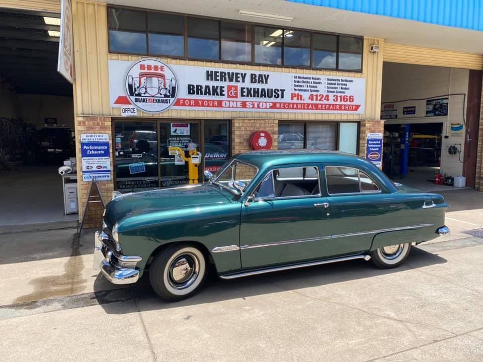A Green Classic Car Parked in Front of Hervey Bay Brake & Exhaust Automotive Shop — Hervey Bay Brake and Exhaust in Pialba, QLD