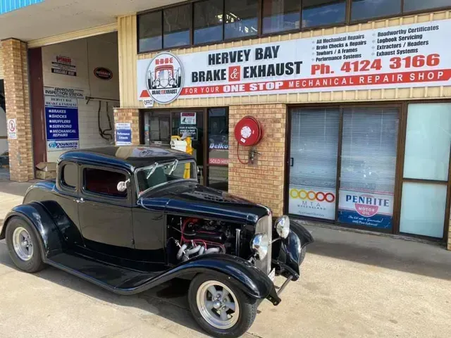 A Black Classic Car Parked in Front of A Hervey Bay Brake & Exhaust Shop — Hervey Bay Brake and Exhaust in Pialba, QLD