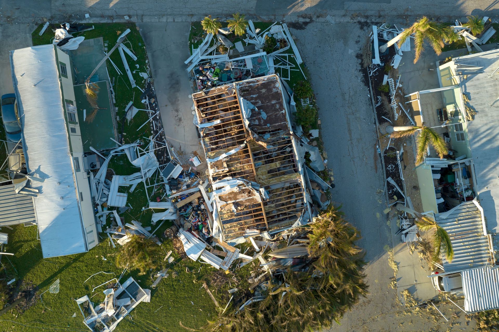 Aerial view of destroyed homes and debris, likely from a hurricane.