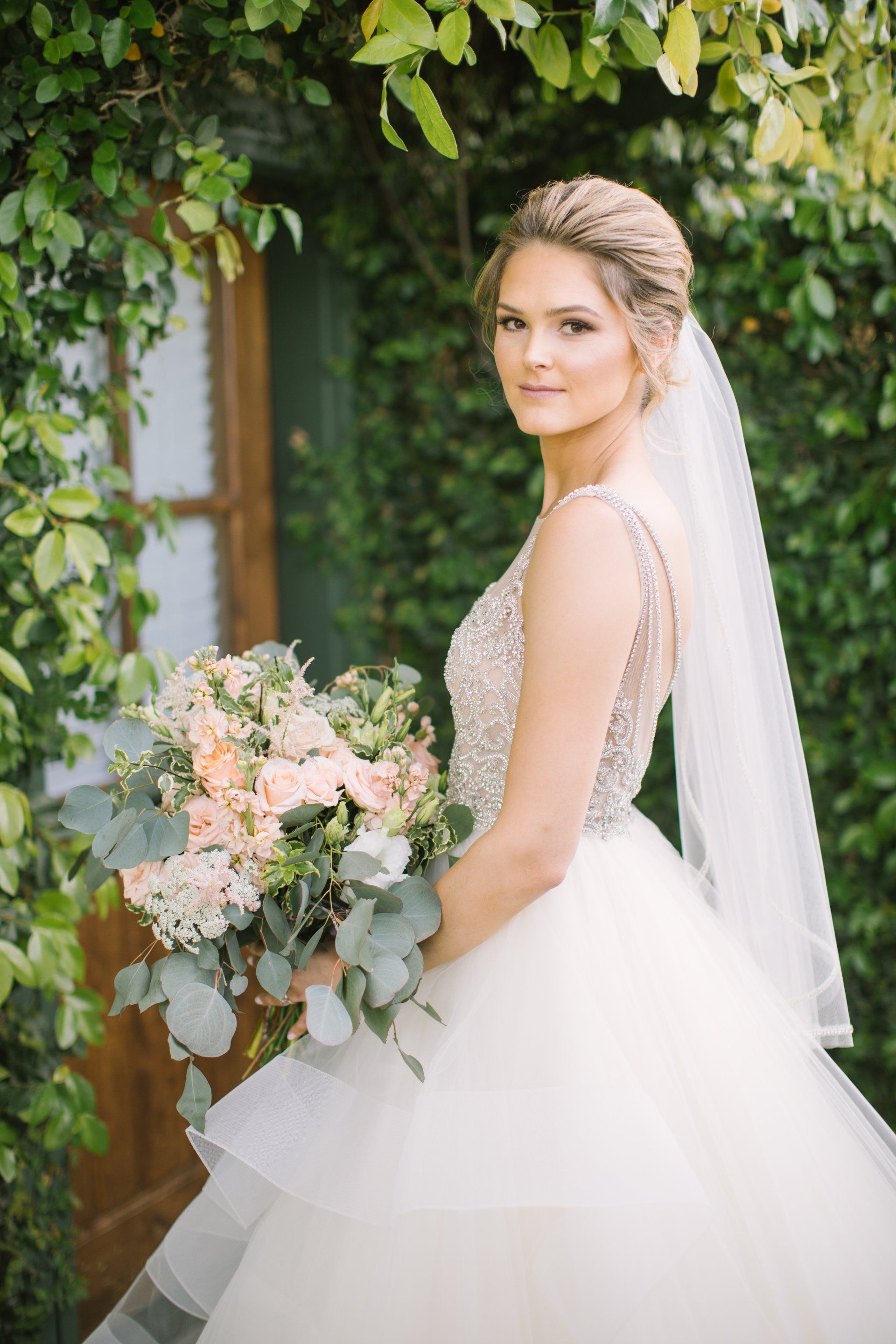 Orange County wedding photography of bride holding flowers