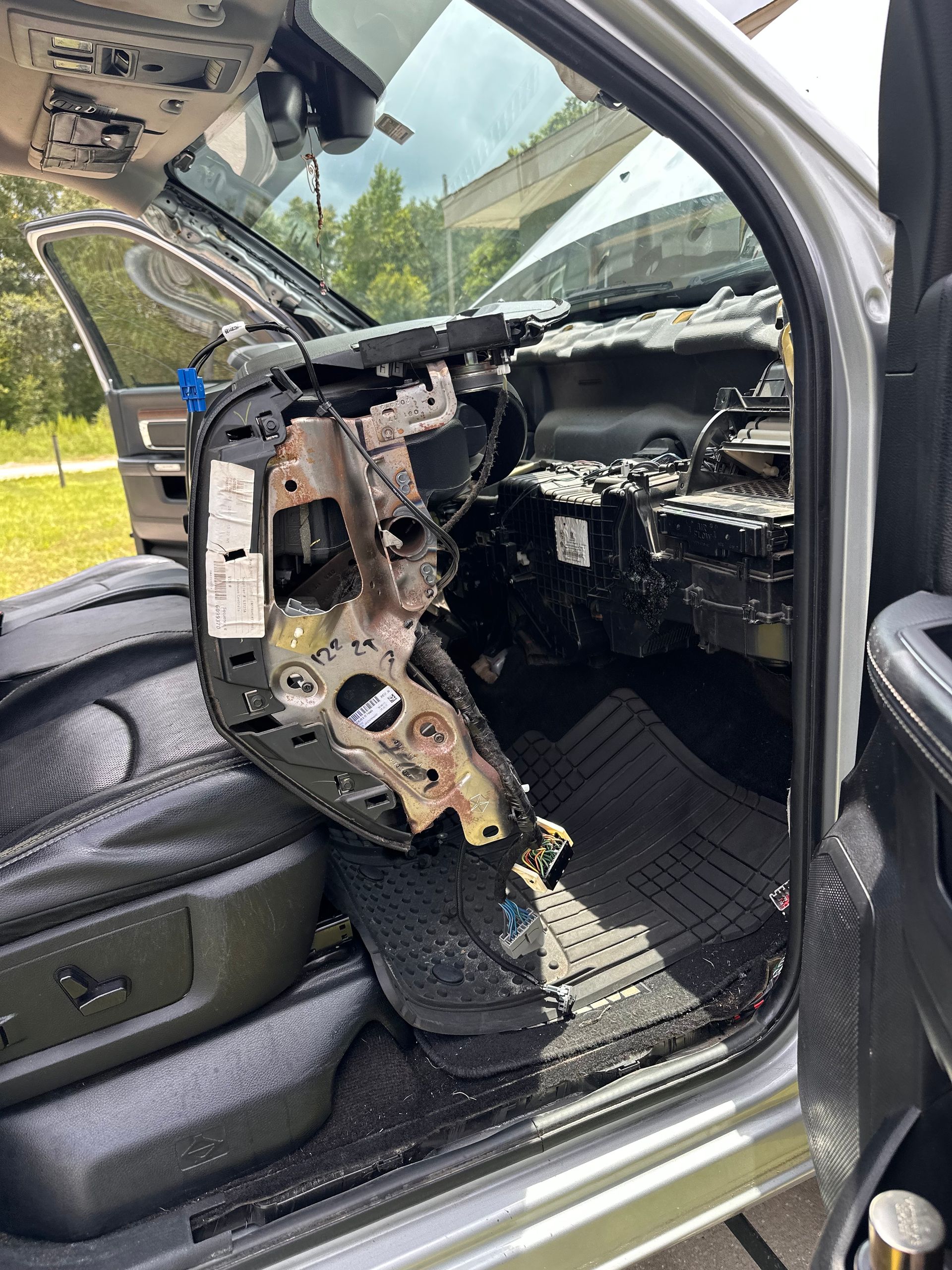 Interior of a disassembled silver car | 3T’s Mobile Automotive Repair Inc.