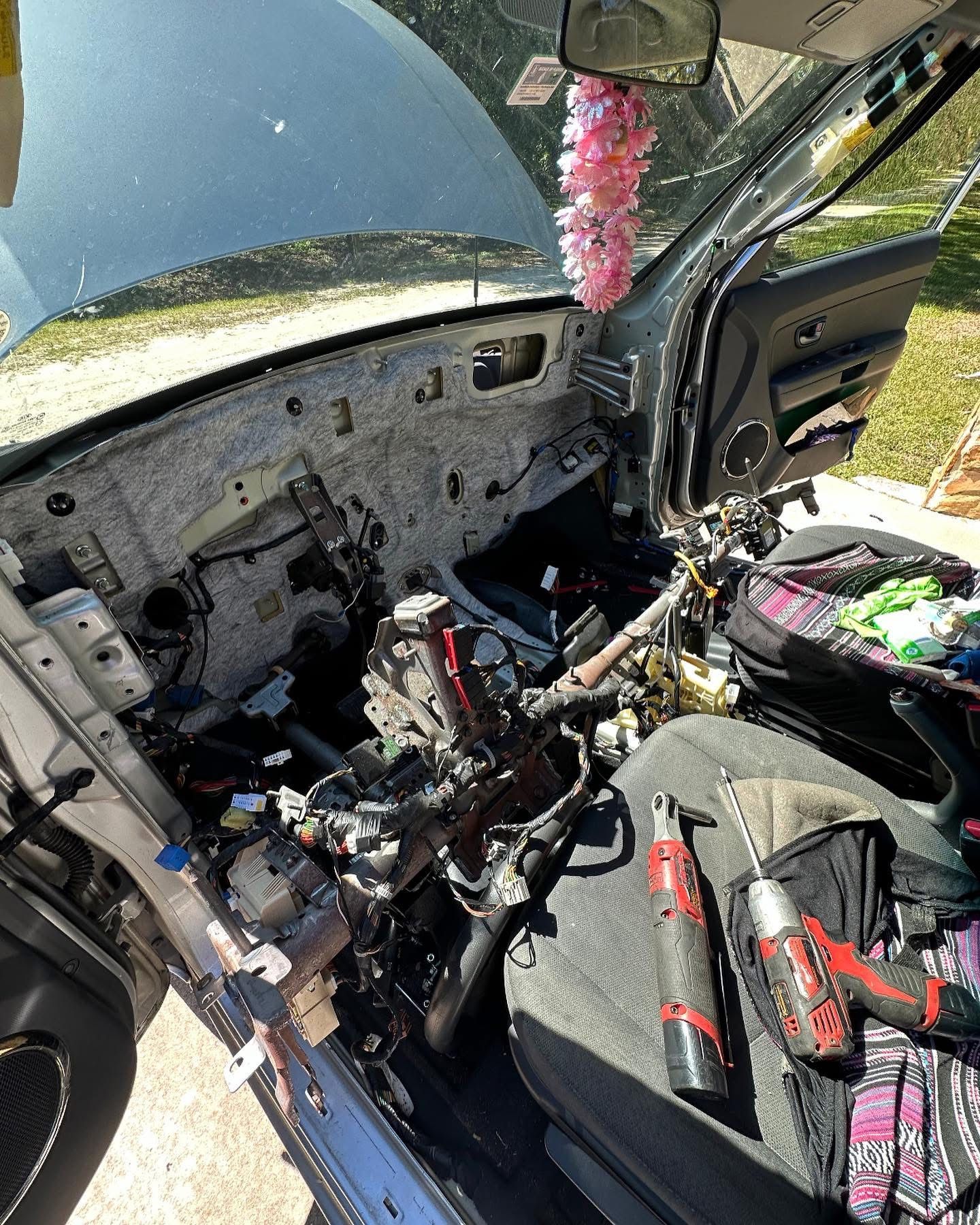 Car interior disassembled; dashboard and components exposed | 3T’s Mobile Automotive Repair Inc.