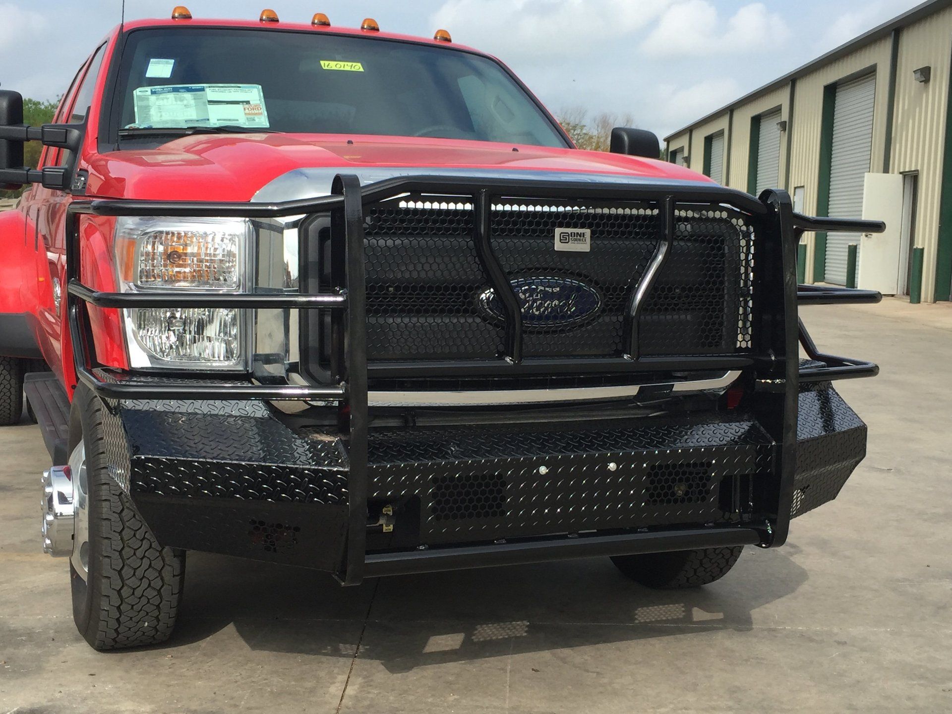 black grill guard on red Ford pickup