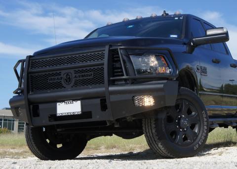 close up view of black pickup truck with black grill guard