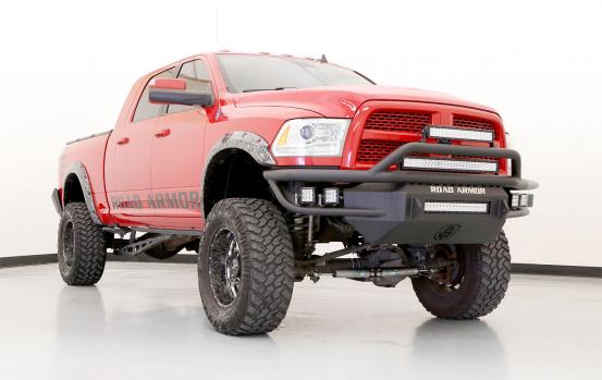 front angle view of red pickup truck with black grill guard and bumper