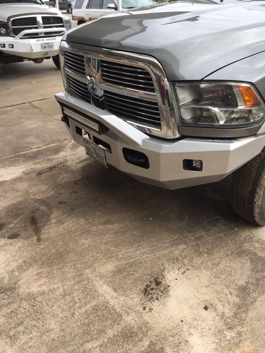 silver Dodge Ram pickup truck with matching silver bumper