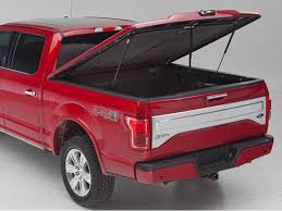 red pickup truck with open red truck bed cover