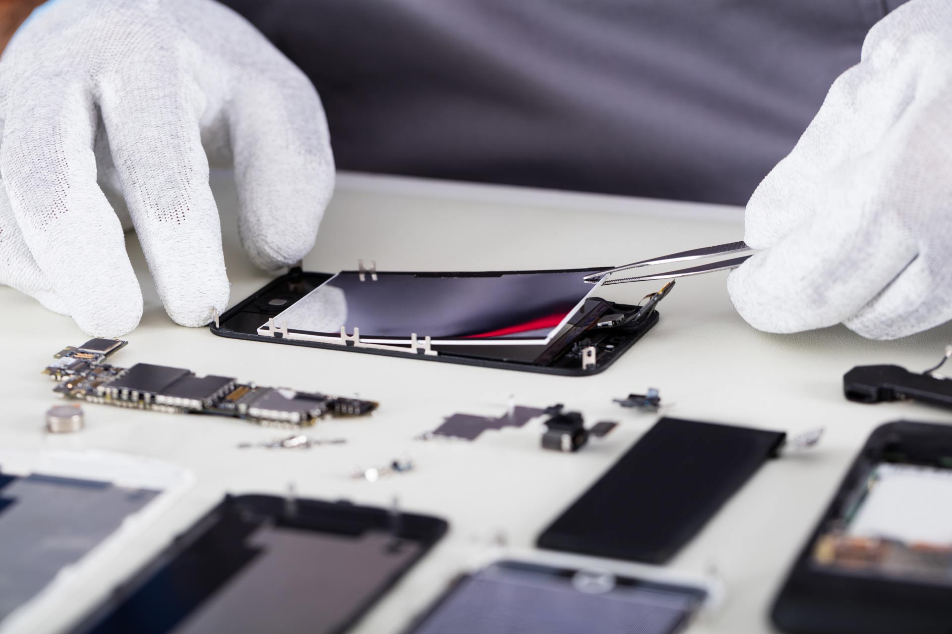 Repairman-Disassembling-Smartphone-With-