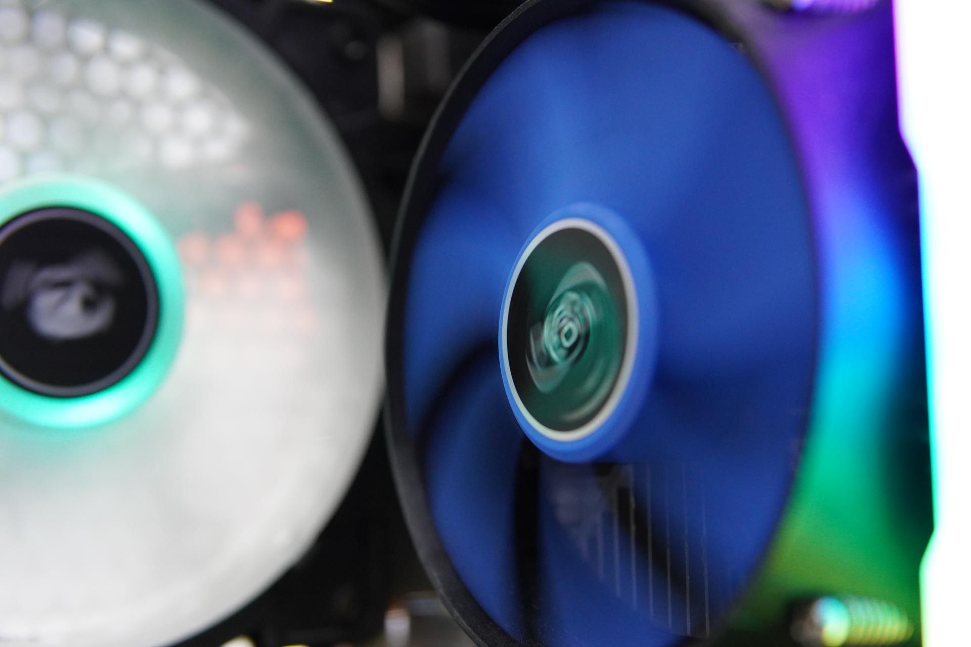 Two computer fans are spinning in a computer case.