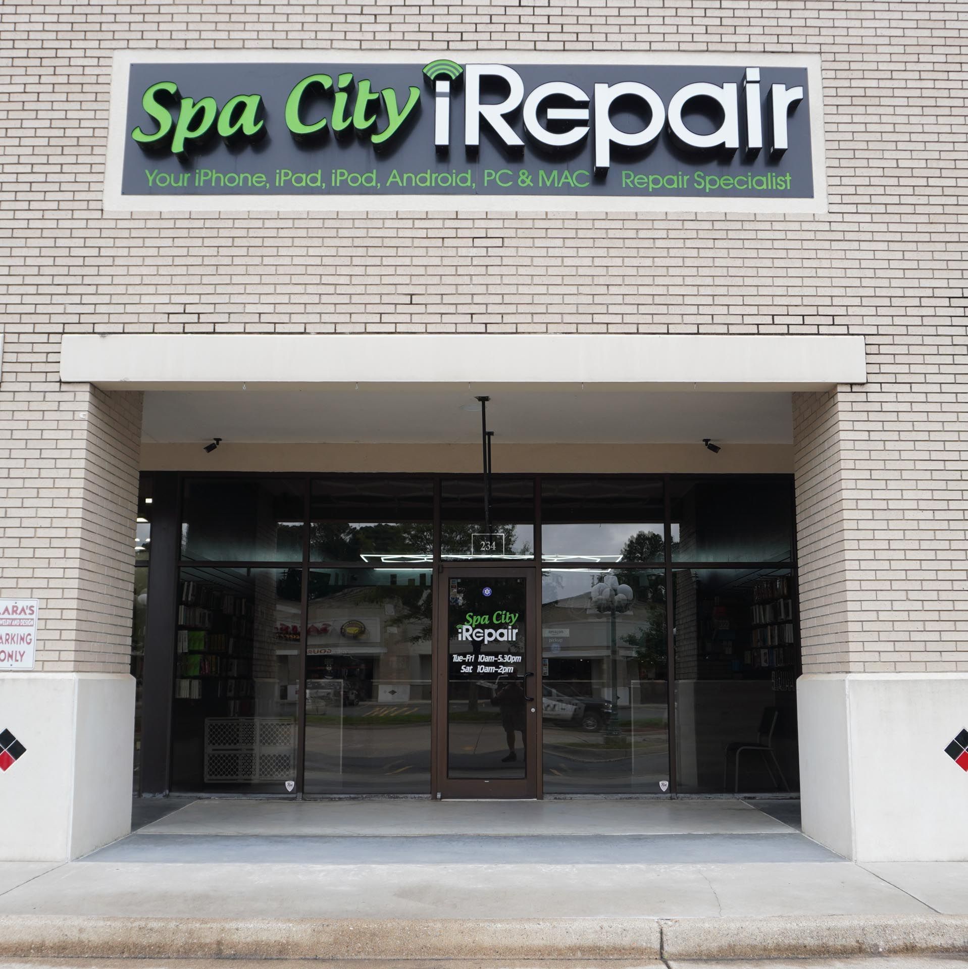 A brick building with a sign that says spa city repair
