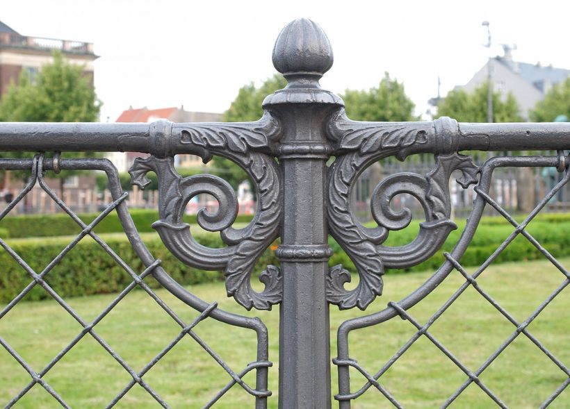 Ornate metal post for metal fencing around a park in Derby