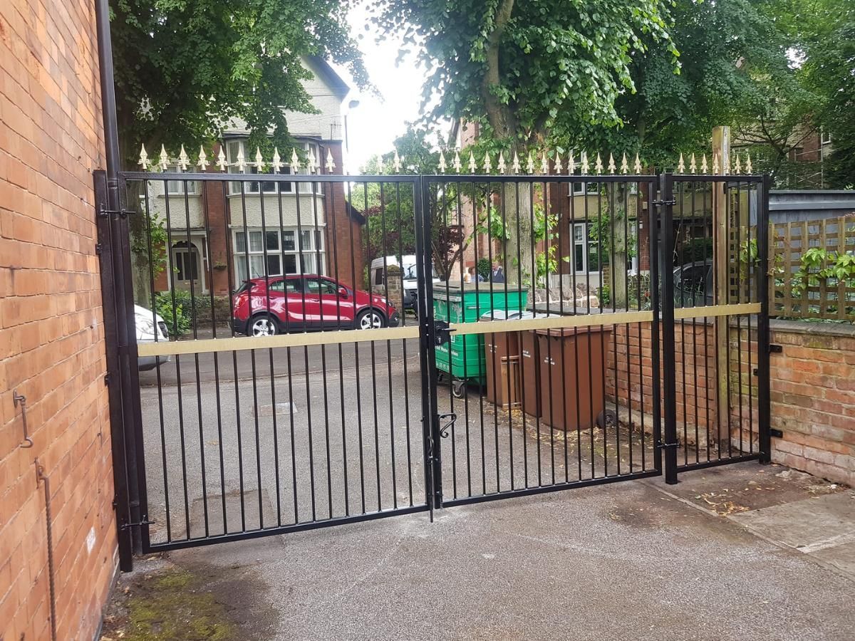 Metal Gates & Railings Derby rectangle gold fleur de lis topped and horizontal bar metal driveway gates