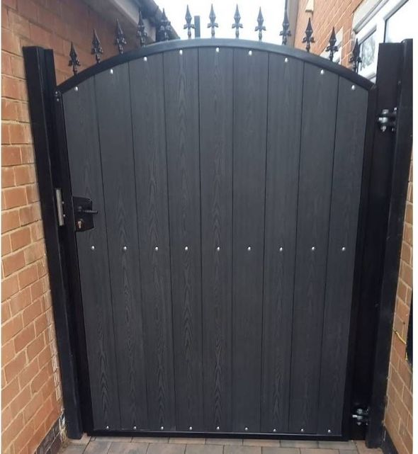 Metal Gates & Railings Derby arched composite gate with fleur de lis topping