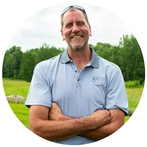 A man in a blue shirt with the word excel on it