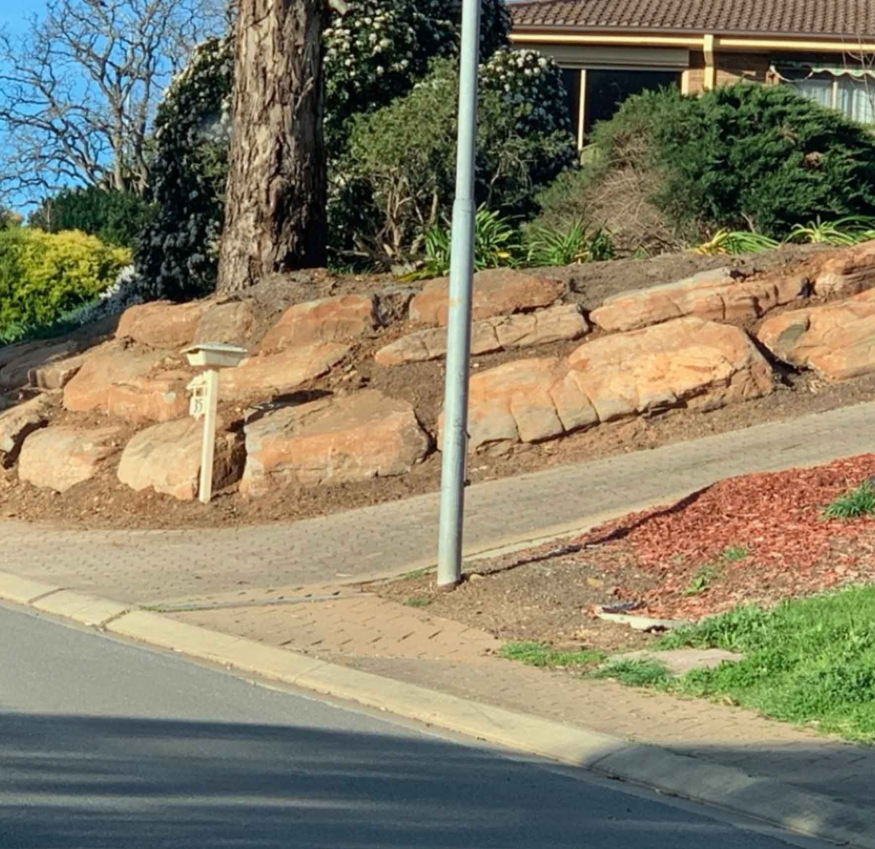 There Is A Large Rock Wall On The Side Of The Road – Blackwood SA - Blackwood Earthmoving