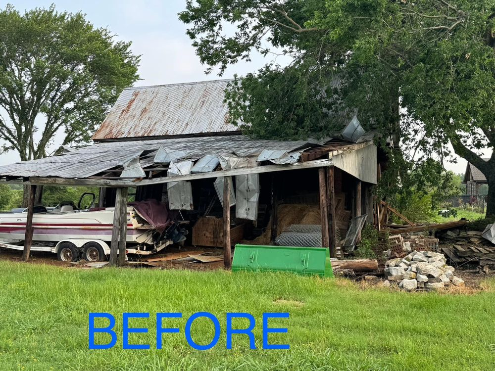 A before picture of a barn with a boat in it.