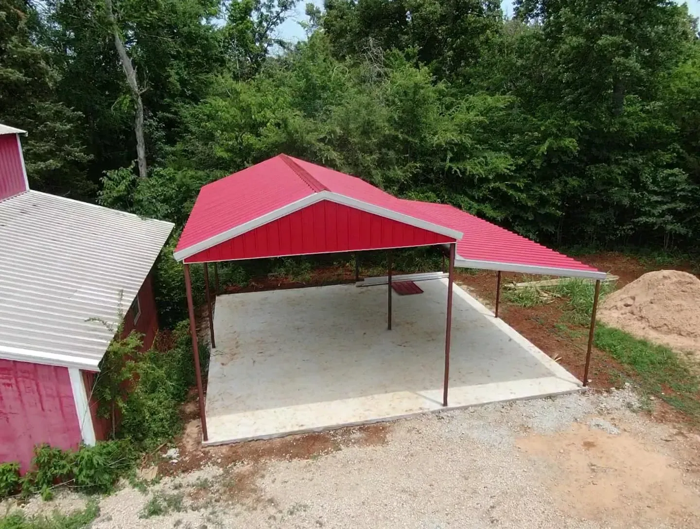 An aerial view of a carport with a red roof