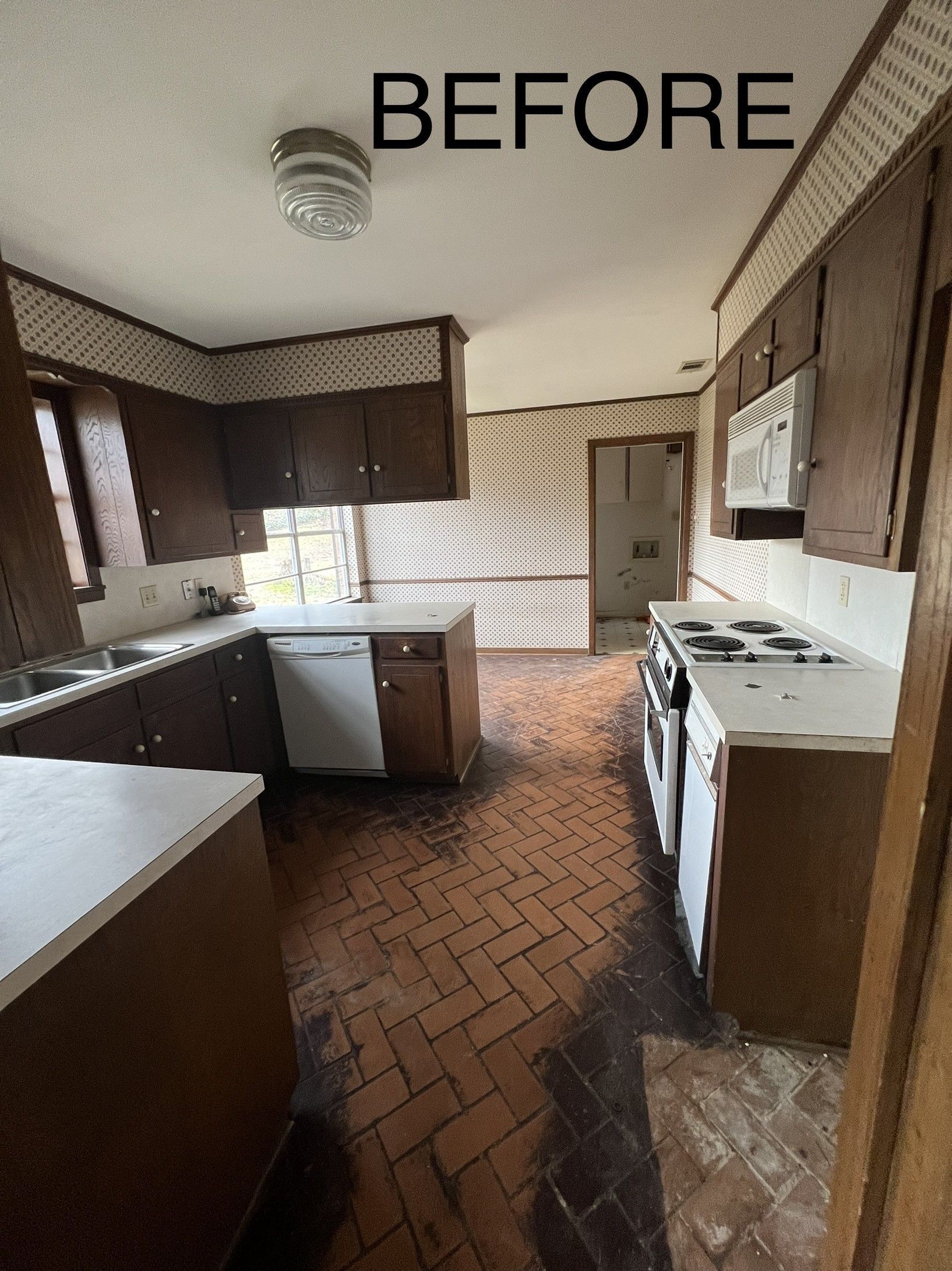 A before picture of a kitchen with brown cabinets and white counter tops