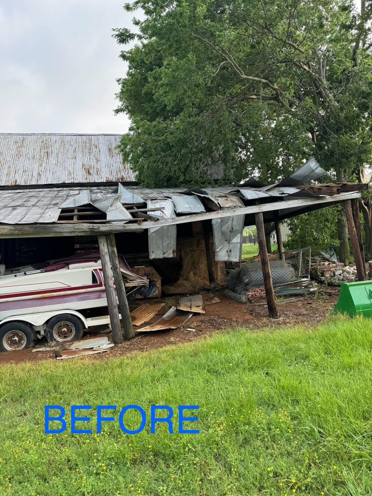 A before picture of a barn with a boat in it.