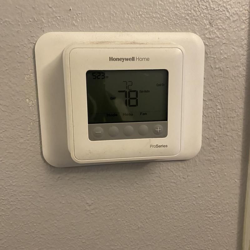 Honeywell thermostat on a gray wall. Displays current temperature of 72°F, set to 78°F, and the time 5:23 PM.