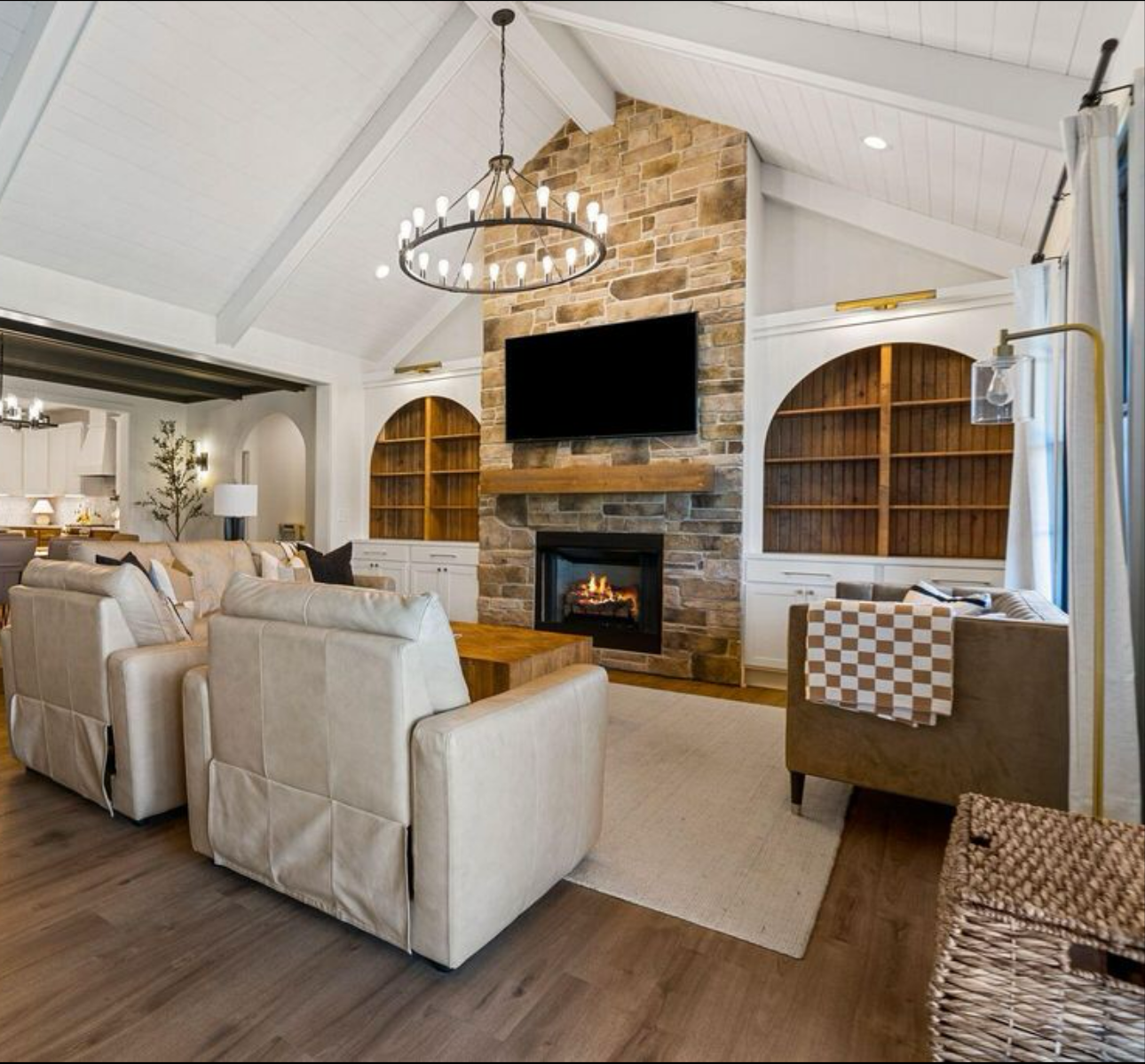 A living room with a fireplace and a flat screen tv