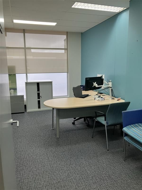 A Small Office With a Desk , Chairs and a Computer — Ballina Removals & Storage in Alstonville, NSW