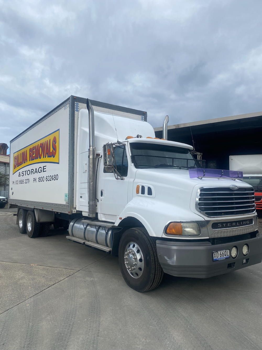 A White Semi Truck is Parked in a Parking Lot — Ballina Removals & Storage in Alstonville, NSW
