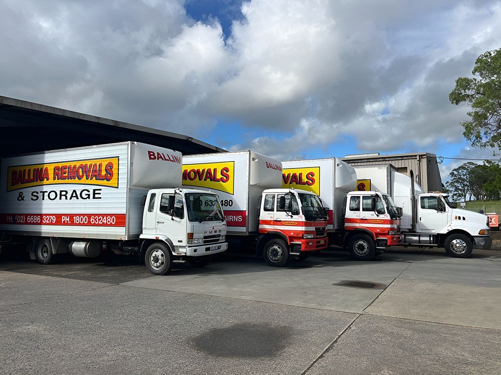 Ballina Removals & Storage Trucks Parked Under a Shaded Area — Ballina Removals & Storage in Ballina, NSW