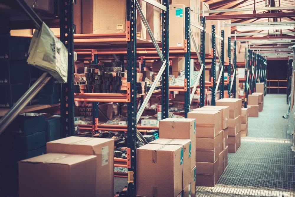 A Warehouse Filled With Lots of Cardboard Boxes on Shelves — Ballina Removals & Storage in Alstonville, NSW