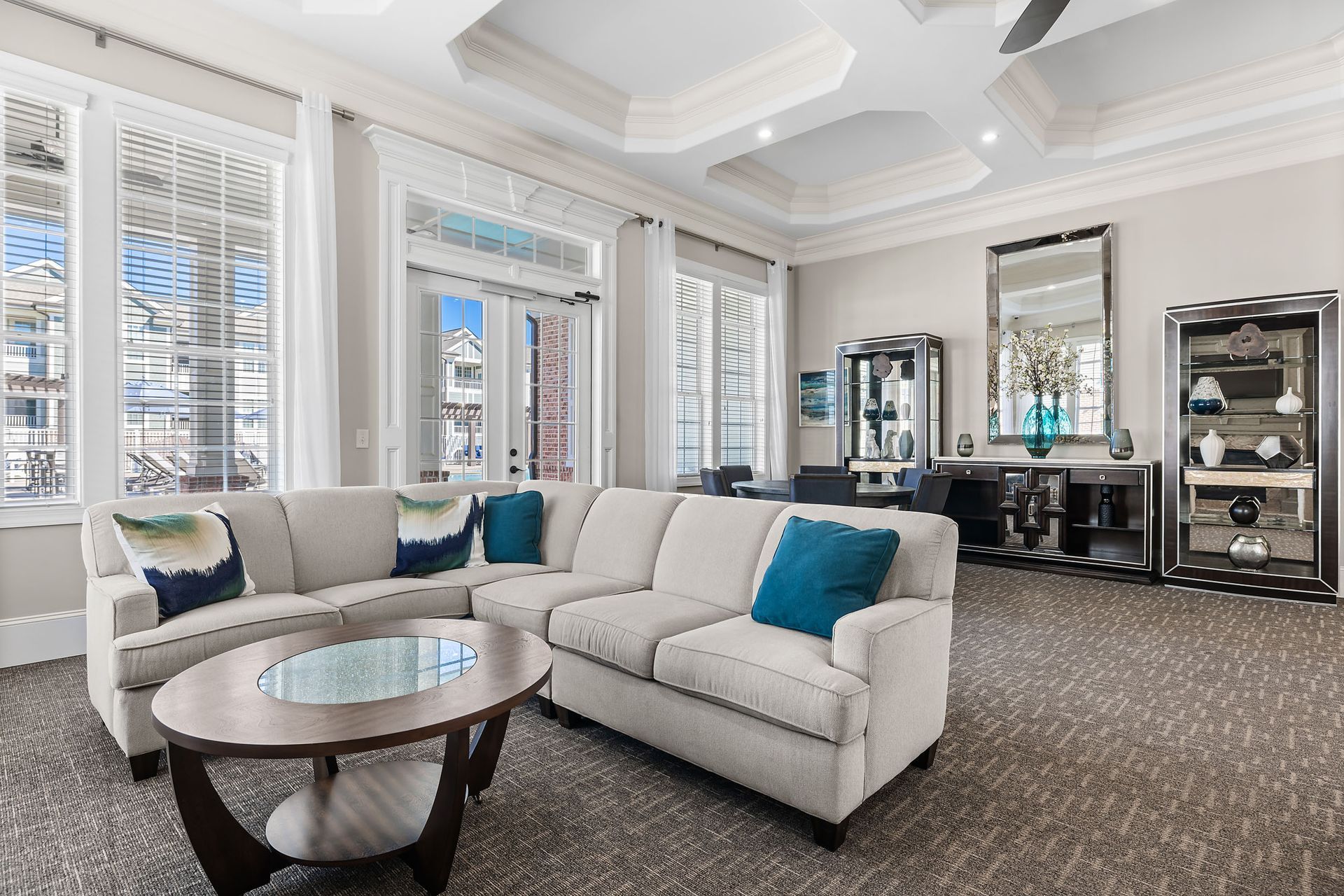 Apartment clubhouse filled with furniture and a coffee table at Marquis Ellis Crossing offers apartments for rent in Durham, NC.